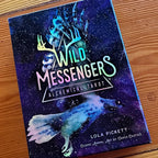 Wild Messengers® Alchemical Tarot holographic box sample on wood floor, Costa Rica